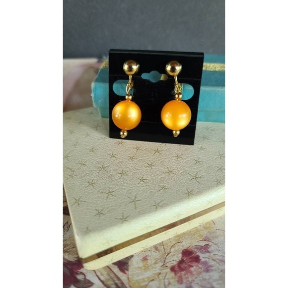 Celebrity Orange Dangling Clip-on Earrings - Picture 4 of 10
